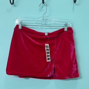 Urban Outfitters pink velvet mini skort